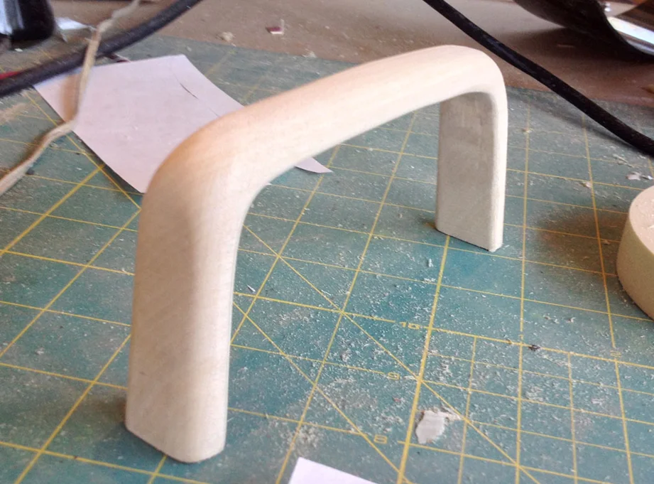 The handle was cut from a piece of 3/4” MDF and sanded to shape.