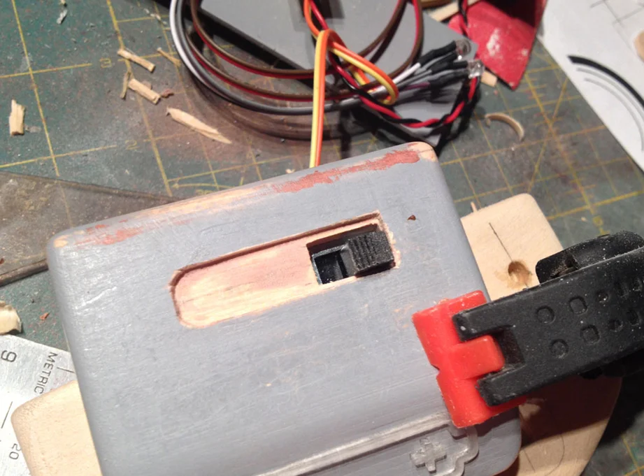 The switch lever sticks out of the hole.