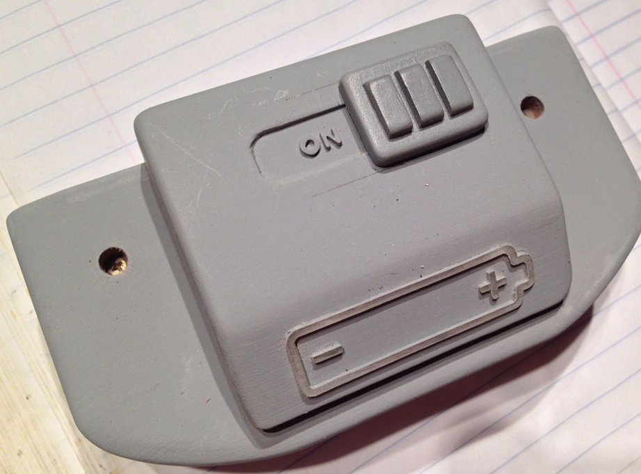  A switch cover was made from MDF and glued over the electronics switch lever. 