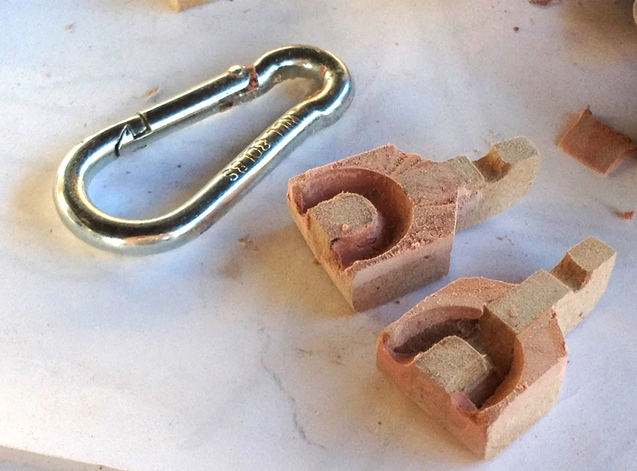 By coating the link with mold release, I could remove each half of the bracket and have perfectly fitting cavities