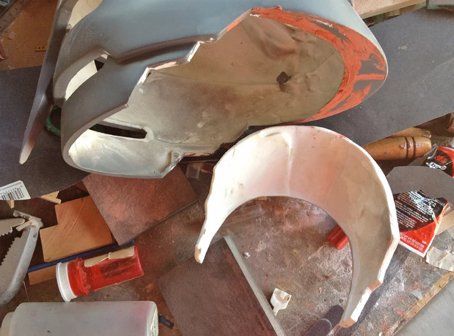 Since the neck hole is too small for the helmet to fit over the head, I had to cut off the lower plate and clean up the edges with putty.