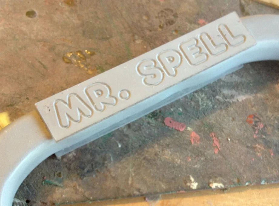To make the engraved name plate on the handle, I had the letters cut into 1/8″ acrylic panels and glued them to both sides.