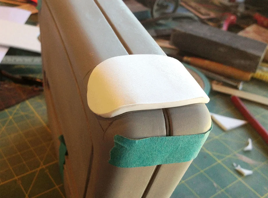 I then transferred the design to a sheet of 1/4″ Sintra. The Sintra was heated and bent over the base.