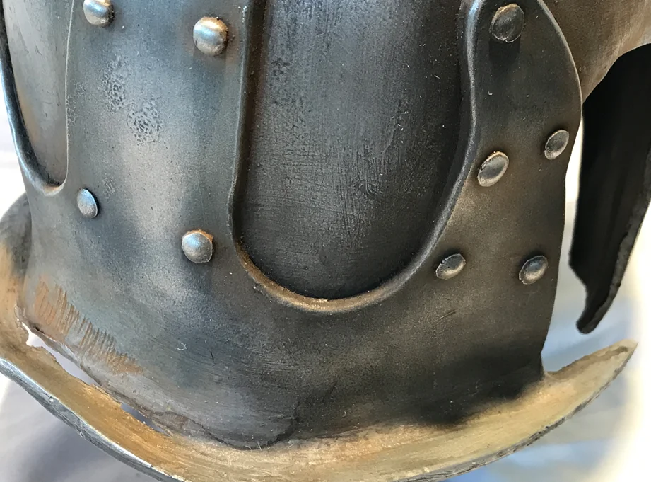 The back plate had a thin spot in the casting. Rather than putty it up, I made it part of the damage.