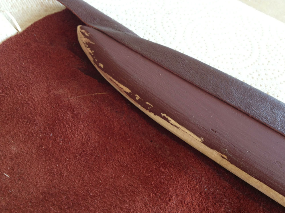  After a few failed attempts at stitching the leather on the scabbard, I decided to just glue it so that it would have a perfect seam. Just in case there was a gap in the seam, I pre-painted the wood a reddish brown to disguise the seam. 