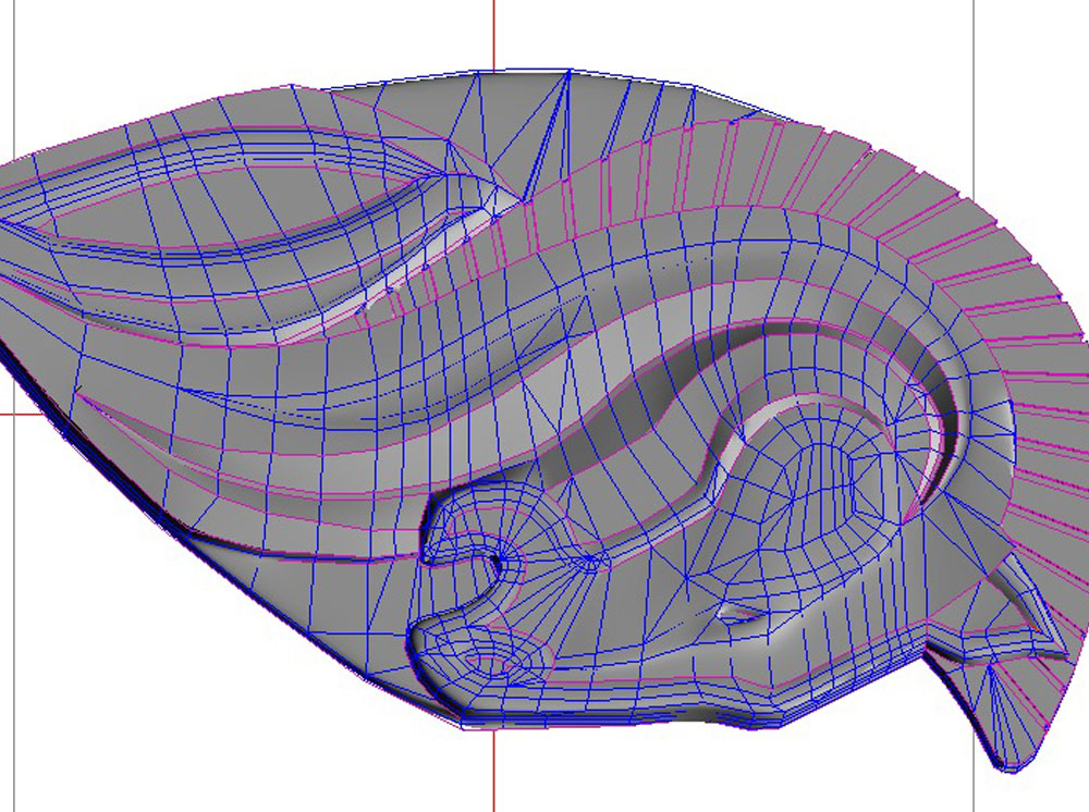  In sculpting the main horse, the software smooths the edges between polygons so you can describe curves with simple geometry. The purple lines are designated as hard edges. 