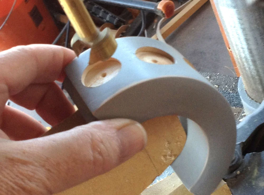 I drilled out holes in the cuff that were just big enough for the stamp to fit inside.