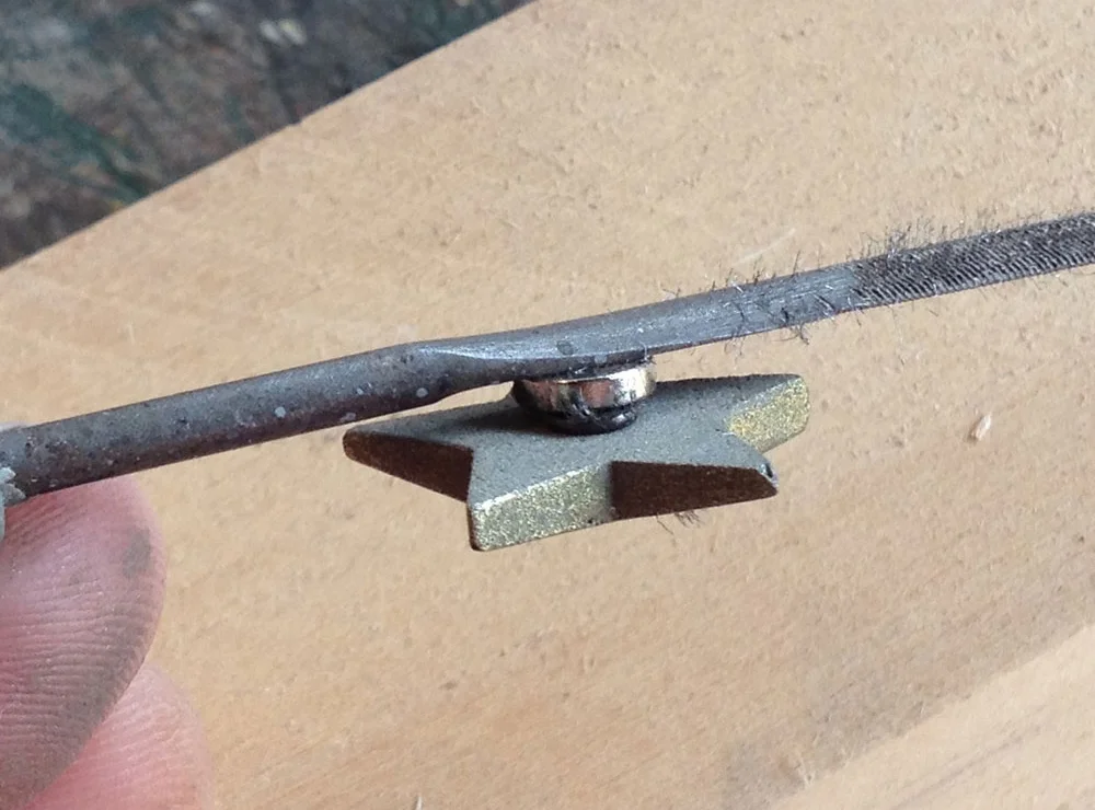 This would allow the star to be held in its hole by a rare earth magnet.