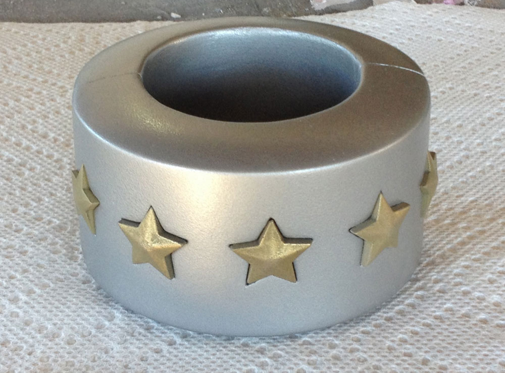  The cuff was painted with several light coats of Rustoleum Hammered Silver. The light coats give you a durable metallic finish without the hammered look. The final stars are in place but apparently not oriented in their holes correctly in this pictu