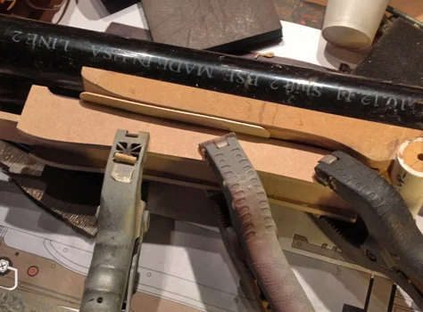 The fore grip was initially framed out with 1/4″ MDF so that it fit snugly against the magazine tube.