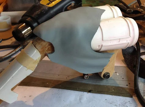 I heat formed thick styrene around the MDF of the pistol grip to make the cover.