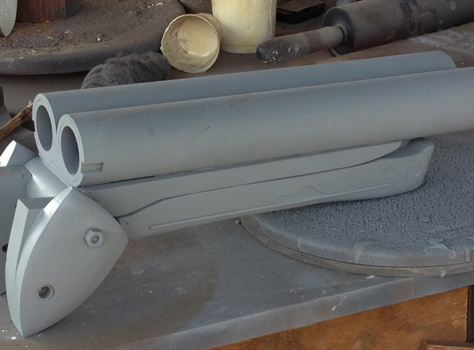  The hinge was glued and bolted to the barrel assembly, puttied smooth and coated in primer. 