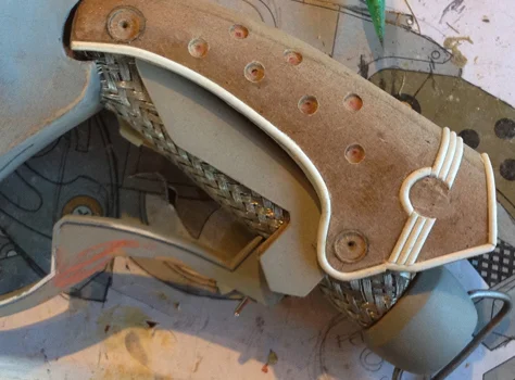 I drilled holes and added half round styrene piping to the outer grip.