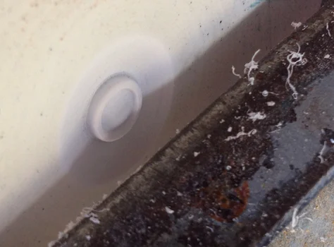 I chucked a piece of thick styrene to the lathe and carved a custom rivet that would be duplicated in resin.