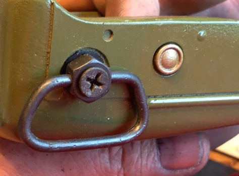 Here is a painted resin rivet glued onto the fore grip.