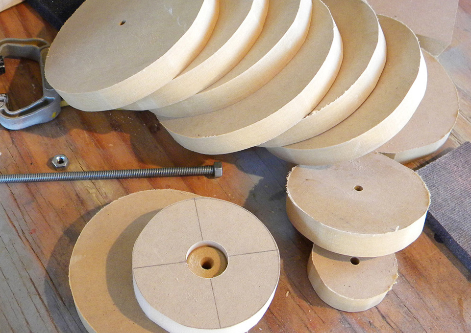  I started by cutting 3/4″ MDF into discs that could be glued together on a threaded rod. 