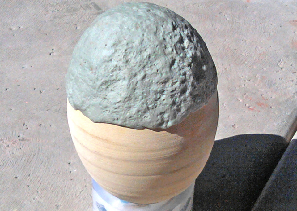  I started by adding epoxy putty to the bottom and creating a stone texture with a silicone stamp – I molded a big rock out in the yard for occasions like this. 