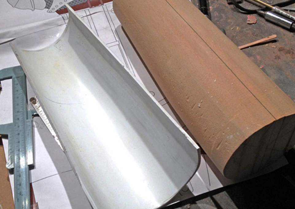  I started the vambrace (part that covers the forearm) by lathing a MDF master that roughly matched my forearm. I heated thick styrene and wrapped it over the form. 