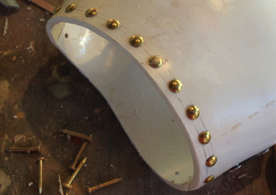  I cut nail heads to act as rivets along the edges of the hand plate. 