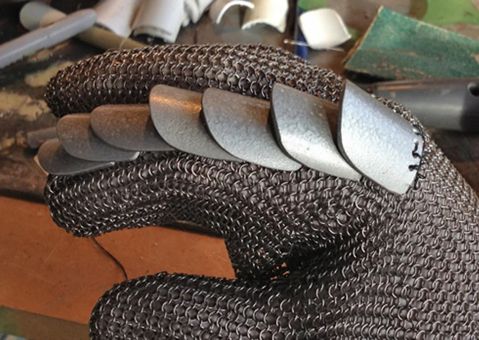 I then hot glued the strip on to each finger of the chain mail glove.