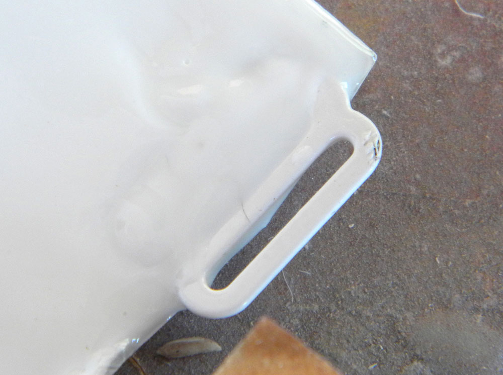  Tacking the hooks in place, I poured a small amount of resin in the corners to lock them in place. 