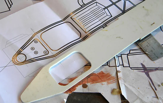 I cut the front plate of the muzzle assembly from 1/8” styrene.