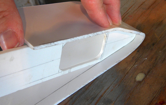  I heated more styrene and formed it around the front plate. Once it was the proper shape, I glued it in place. 