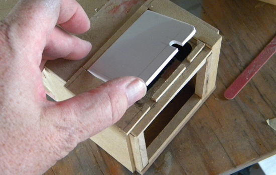  I cut the battery compartment door from 1/8” styrene. 