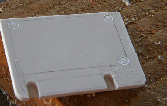  Decorative “rivet” holes were cut into the door with a router bit chucked into the drill press. 