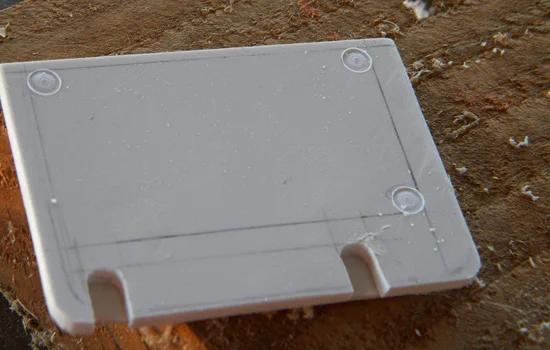 Decorative “rivet” holes were cut into the door with a router bit chucked into the drill press.