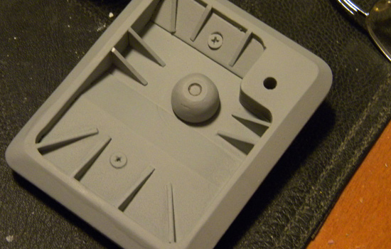  Styrene details, screws and a clicking knob were added to the cover. 