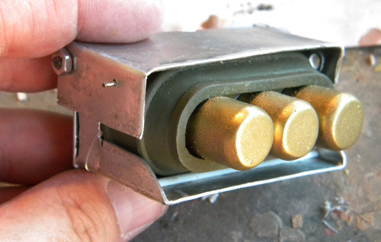  The battery seated in the holder. 