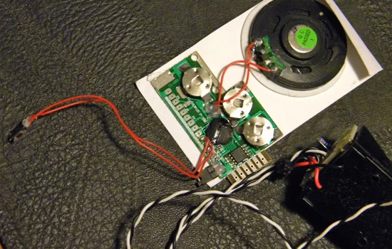 For the sound, the client found a recordable greeting card. He was able to hook it up to his computer via mini-usb and load the actual laser gun sound from the game.