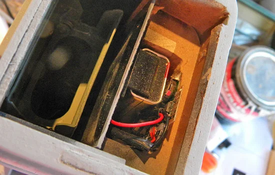 Real batteries fit below the fake one.