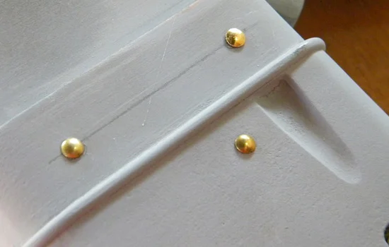 Some nails standing in for rivets.