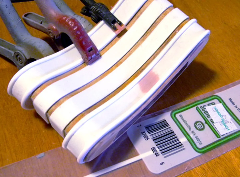 Next I glued half round styrene strips to the outer edging.