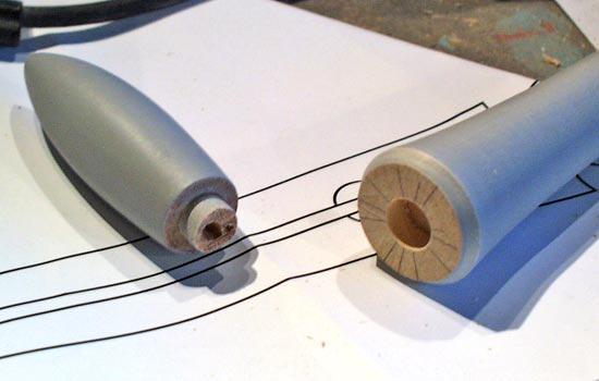 The spike is glued into a hole in the base of the tail piece.