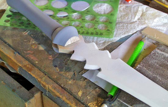 I cut out the blade and glued it into a notch in the head piece.