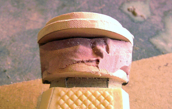 I glopped Bondo into the pommel until it filled the framed area.