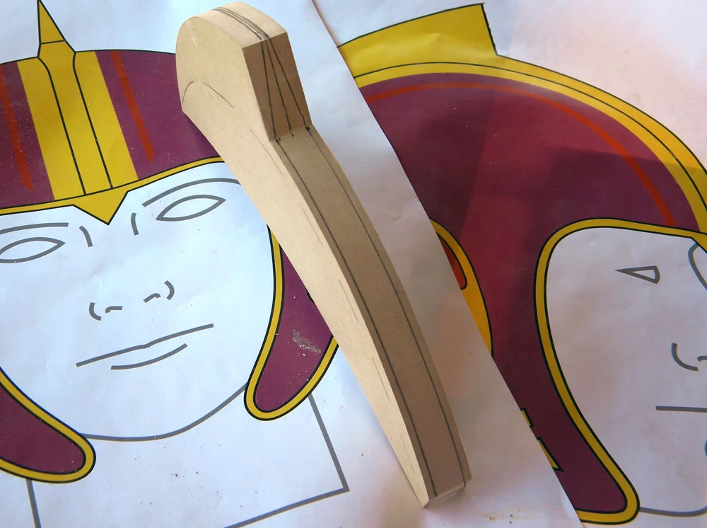 I cut the crest profile out of 3/4” MDF, and marked where it would need to be sanded to match the taper of the plans.