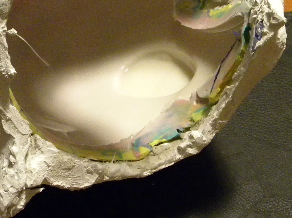 I poured a small amount of Smooth-On 65D into the helmet and slushed it around until it hardened (usually in 3-5 minutes). I worked in sections and built up several coats to make a stable helmet shell.