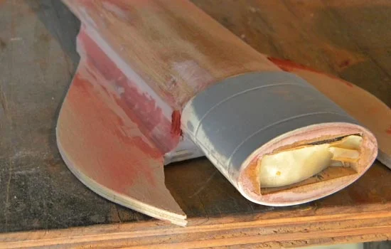 I blended the space between the scabbard and the back plate with Bondo.