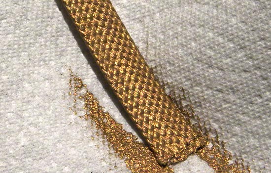  I wasn’t able to find gold ribbon in the proper width, texture and color make Rekki’s scabbard ribbon, so I found the closest match in size and texture and painted it with gold acrylic. 