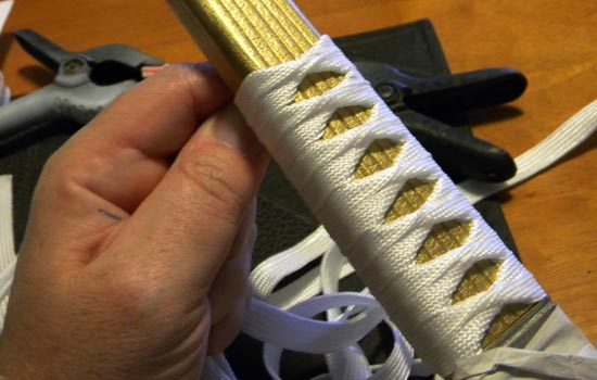  I found a tutorial online for tsuka-maki (the Japanese method of wrapping sword handles) with tsuka-ito (the ribbon used to wrap it). 