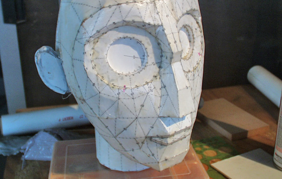 I sealed the paper with a coat of fiberglass resin. The screw at the base of the neck would be made separately.