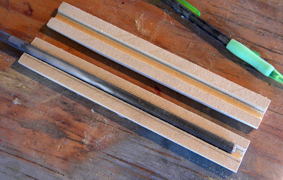  I cut channels for the steel support rod in MDF grip halves. 