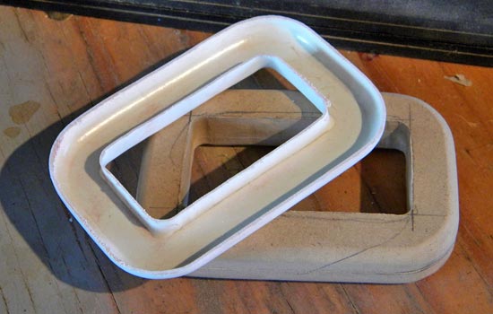 The padding bracket after it had been trimmed down for use.
