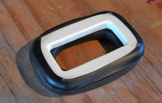 A test fit of the padding attached to the bracket. Eventually I would glue down the edges of the vinyl to the top of the bracket.