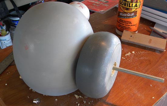 The collar attached to the head with the threaded rod exposed to attach to the shaft.