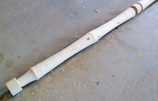 To make the long shaft, I lathed it in 2′ sections out of 1-1/4″ poplar dowel. A longer piece on the lathe just wiggled too much in the center to work.